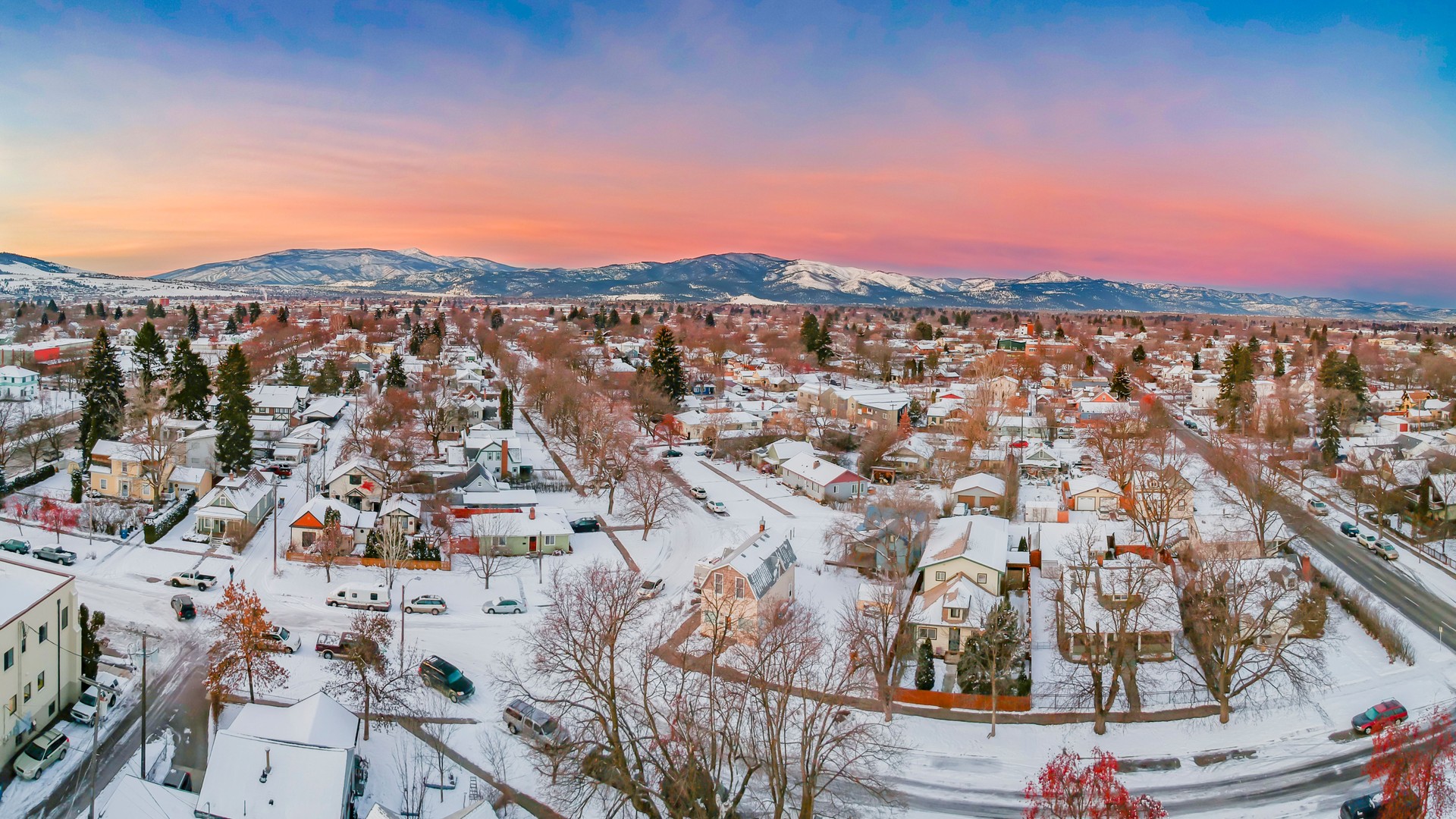 Aerial view of snow covered cityscape Missoula during sunset